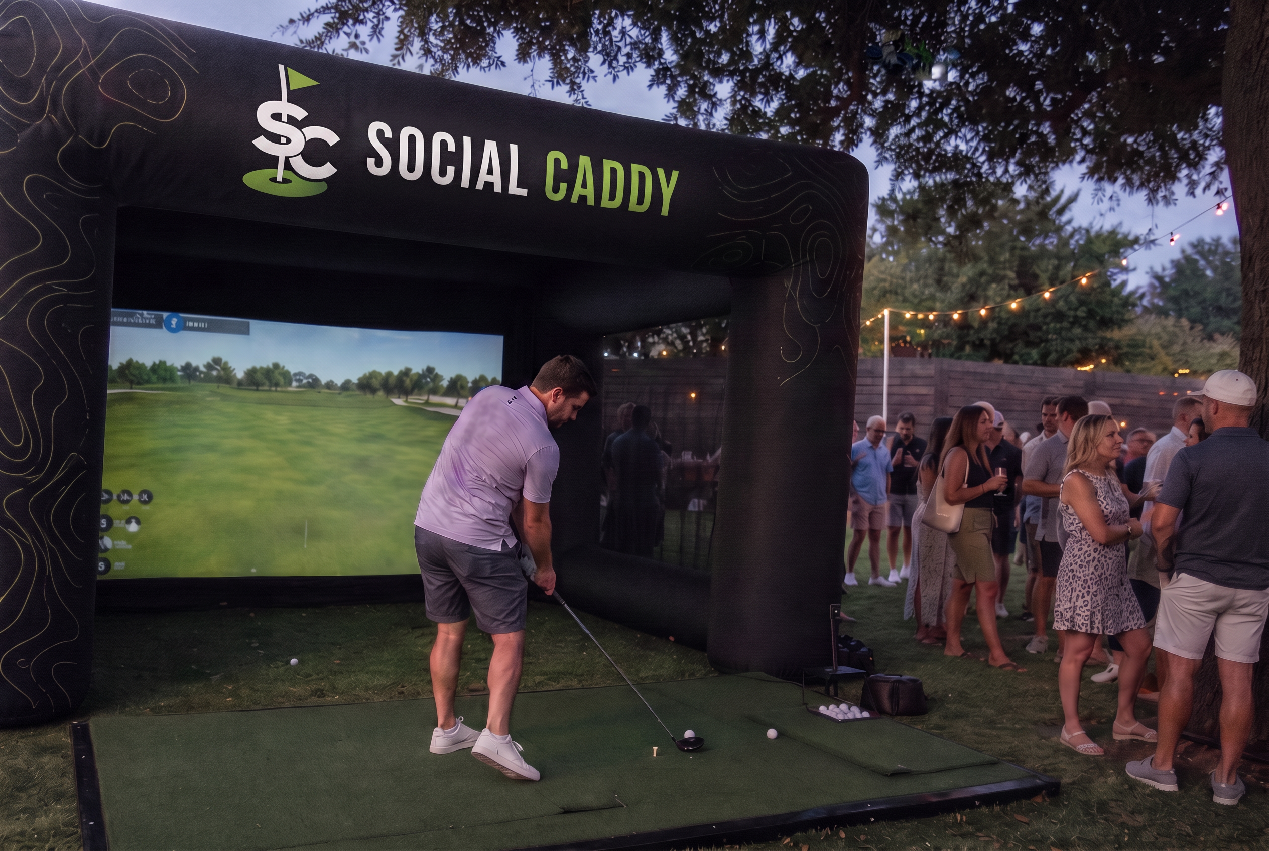 Golfer teeing off into the Social Caddy mobile golf simulator at an outdoor event